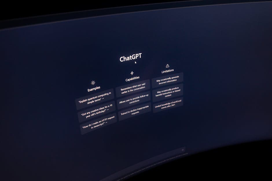 Close-up of a computer screen displaying ChatGPT interface in a dark setting.