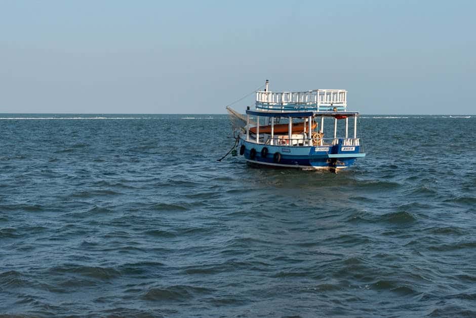 A tranquil boat floating on the blue waters of Porto Seguro, Brazil.