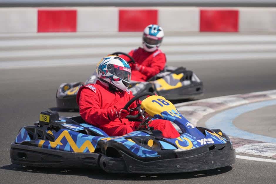 Two racers competing in a thrilling go-kart race at Yas Marina Circuit in Abu Dhabi.